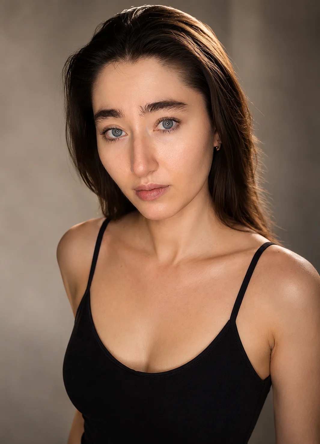 Close beauty portrait of Yaroslavna against a warm studio background